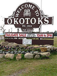 Sign: Welcome to Okotoks, Inc., 1904, Pop. 11,664.