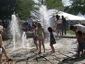 Children playing the in Republic Square fountain during the 2006 Austin Fine Arts Festival.