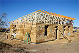 Straw bale home under construction.