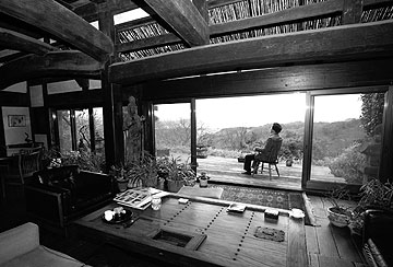 Minka with man on porch.