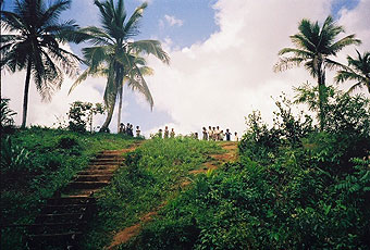 Amerindian children line a hilltop to welcome visitors to a village near Moruca.