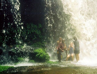 Standing in a pond created by the force of the waterfall near Mount Ayanganna in the Pakaraima Mountains of Western Guyana.