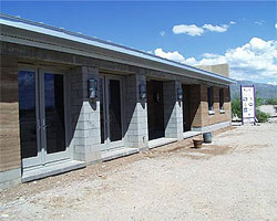 South side of residence with completed facade.