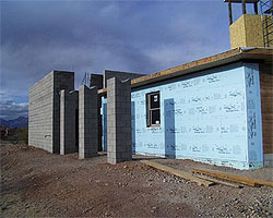 West facade following insulation installation.