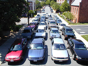 Cars with drivers on street..