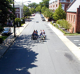 "Bus" with drivers on street.