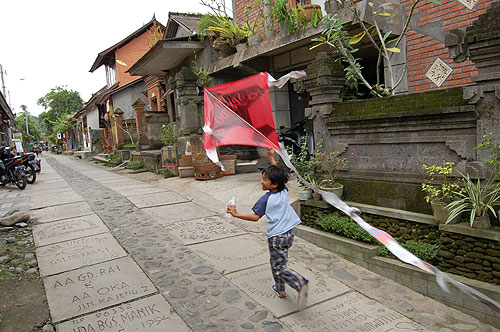 Child flying kite.