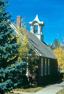 Frisco's old schoolhouse in modern times set among the colors of autumn. 