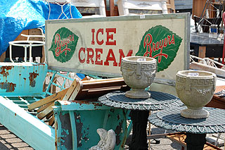 Items for auction: Breyer's ice cream sign, tables, pots, and more.