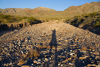 Man's shadow in arroyo