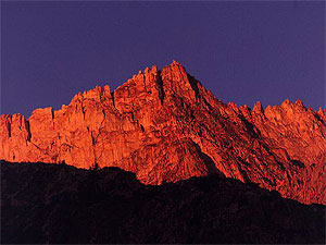 Red mountain ridge at sunset.