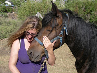 Author Deanne Stillman with Bugz, the mustang that survived the 1998 massacre outside Reno, Nevada.