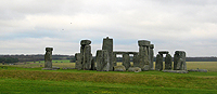 Inside the outer ring, five even-taller trilithons (composed of two upright stones and one lintel) were erected. Of these, two complete examples can clearly be seen at left and right here. At center is the tallest sarsen stone (once also part of a trilithon). It stands 22 feet high and is estimated to weigh 45 tons.