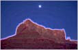 Section divider: Desert mountain at night.