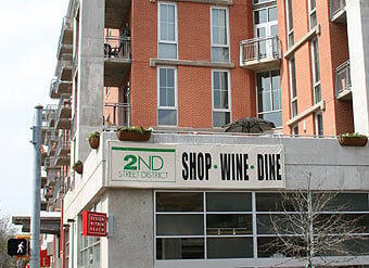 AMLI Downtown project with sign: 2nd Street District - shop - wine - dine.