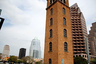 Old fire tower with downtown in background.
