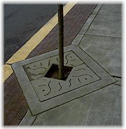Tualatin Commons logo on tree planter base